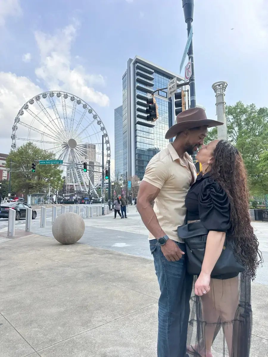 Couple posing near SkyView Atlanta