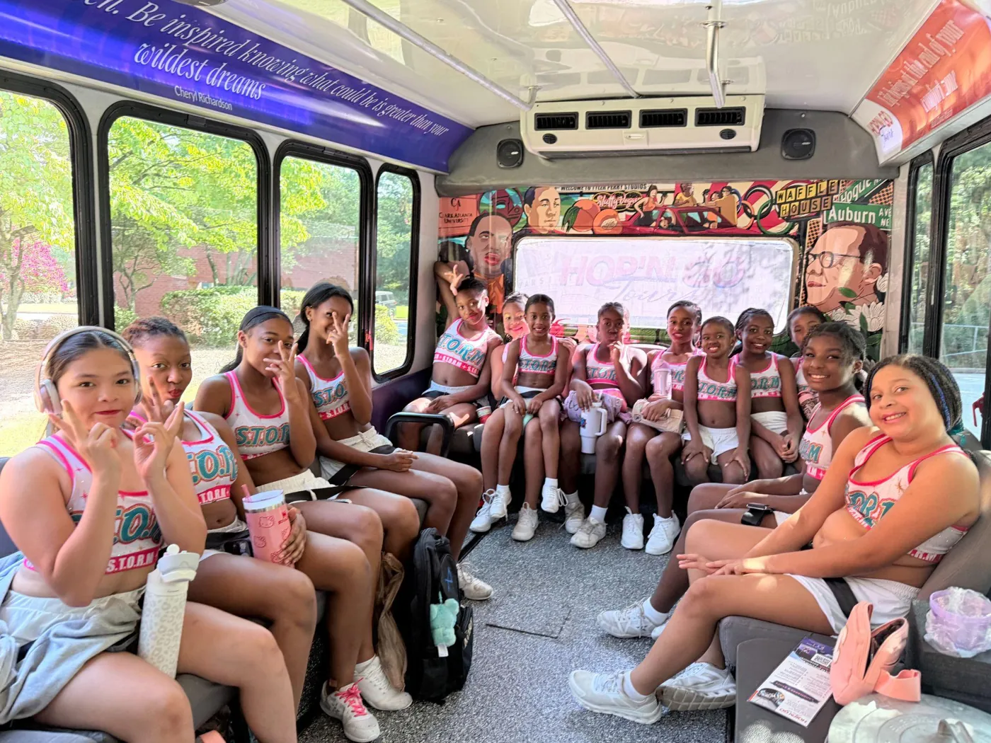 A youth cheer team riding the Hop'N Go Tours shuttle in Atlanta