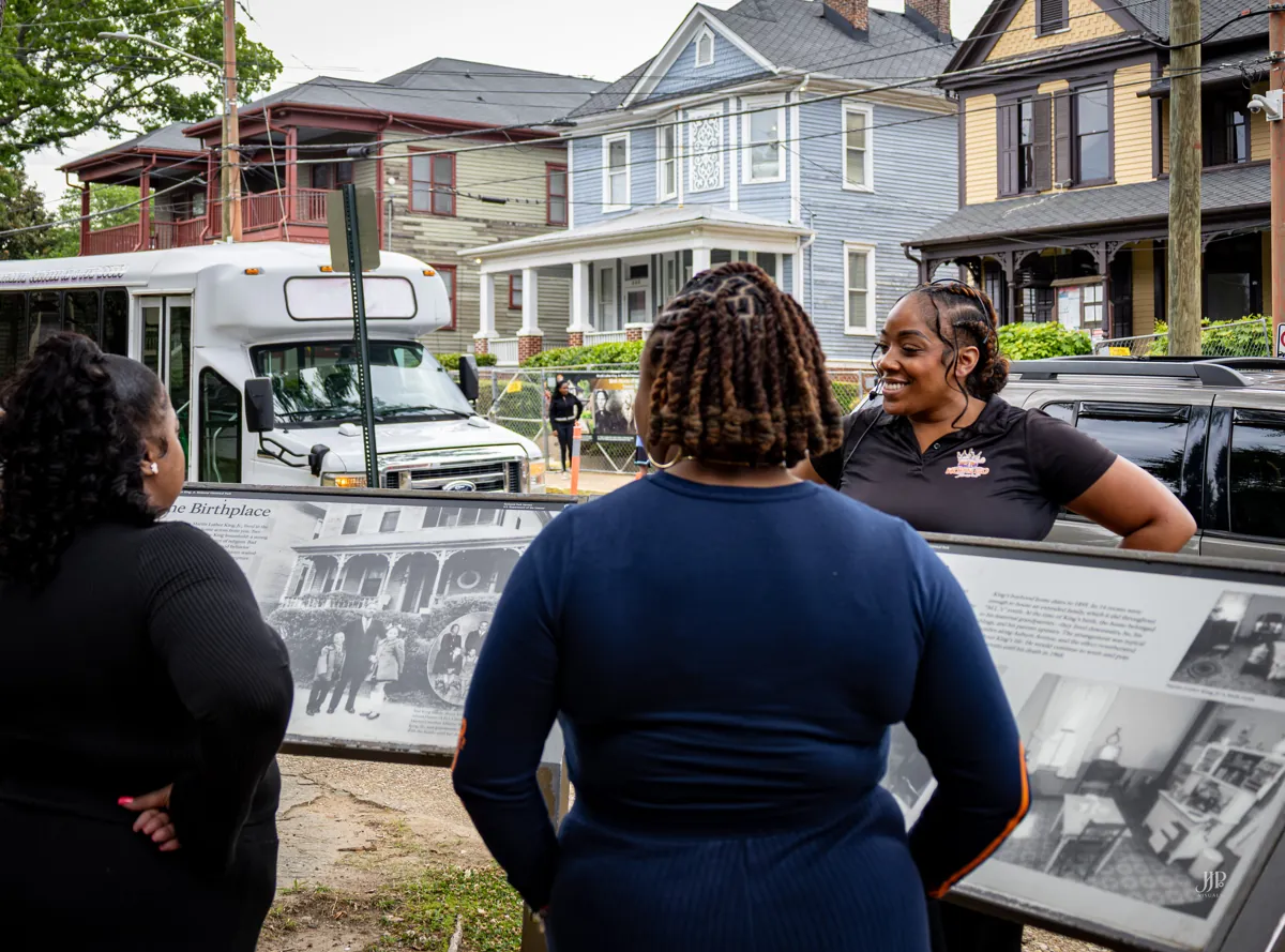 Guests reading a historic marker on the tour